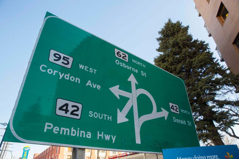 MIKE DEAL / WINNIPEG FREE PRESS
The iconic sign on South Osborne Street just before the underpass attempts to explain the routes through Confusion Corner where Pembina Highway, Corydon Avenue, Donald Street and Osborne Street intersect.