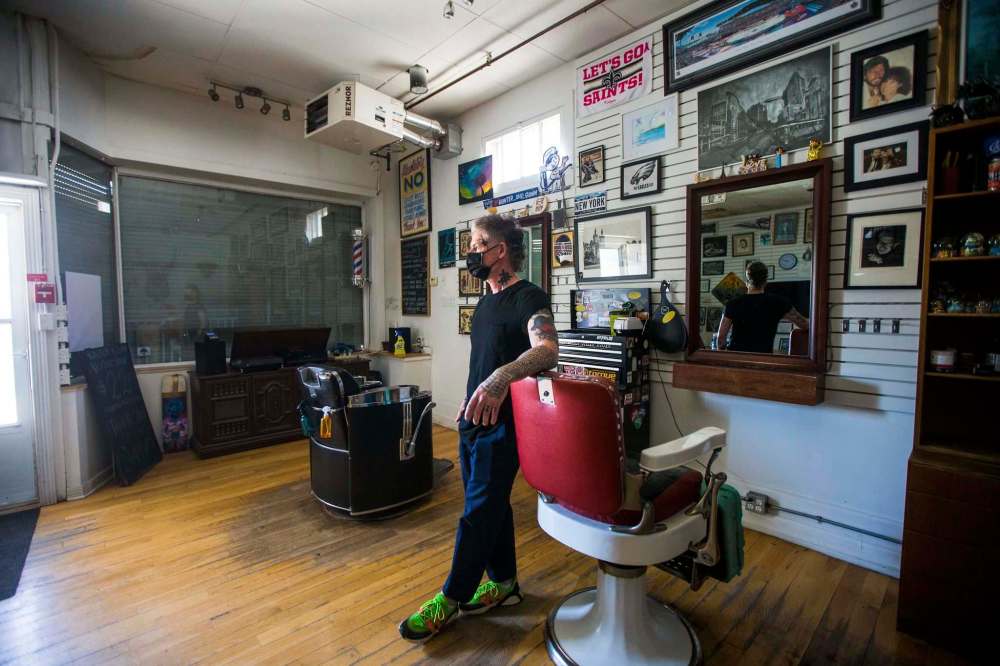 MIKAELA MACKENZIE / WINNIPEG FREE PRESS Jeremy Regan, owner of Hunter & Gunn, poses for a portrait in front of the shuttered barbershop in Winnipeg on Monday, May 10, 2021. For Temur story. Winnipeg Free Press 2020.