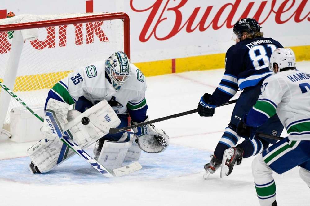 Vancouver Canucks goaltender Thatcher Demko makes one of his 39 saves on the Winnipeg Jets Monday as he stops Kyle Connor during a third-period breakaway. THE CANADIAN PRESS/Fred Greenslade