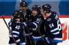 Winnipeg Jets' Mark Scheifele celebrates his goal against the Vancouver Canucks with teammates during the second period in Winnipeg on Tuesda. THE CANADIAN PRESS/Fred Greenslade