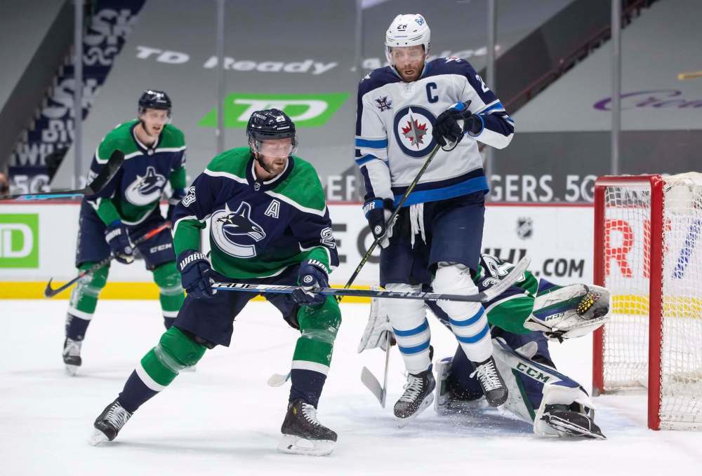 Jets captain Blake Wheeler played through cracked ribs earlier in the season and answered his critics Tuesday by leading the Jets to victory with two goals and two assists against the Canucks. (Darryl Dyck / The Canadian Press files)