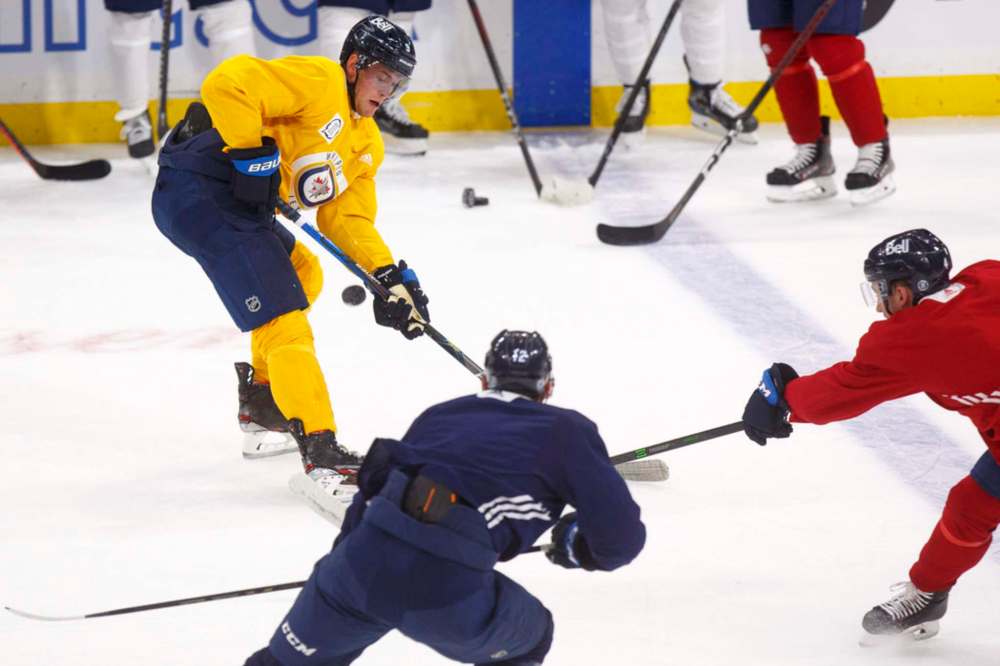MIKE DEAL / WINNIPEG FREE PRESS
Winnipeg Jets' Andrew Copp, in a yellow, non-contact jersey during practice Tuesday, says he finds pundits counting the Jets out in their first-round playoff battle with the Edmonton Oilers