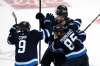 THE CANADIAN PRESS/Fred Greenslade
Josh Morrissey celebrates his third-period goal Sunday with Mathieu Perreault.