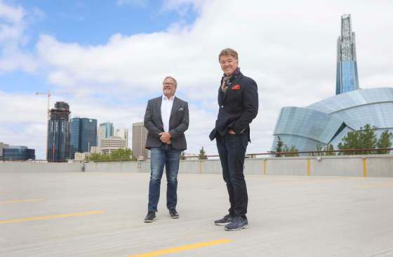 RUTH BONNEVILLE / WINNIPEG FREE PRESSSherpa Marketing president Marty Fisher (left) and Peter George, president and CEO of McKim Communications, are merging their advertising companies.