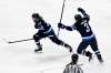 Fred Greenslade / The Canadian Press
Nikolaj Ehlers (left) celebrates with Tucker Poolman Sunday after scoring the overtime winner, his second goal of the game, against the Oilers in his first game back after an injury.
