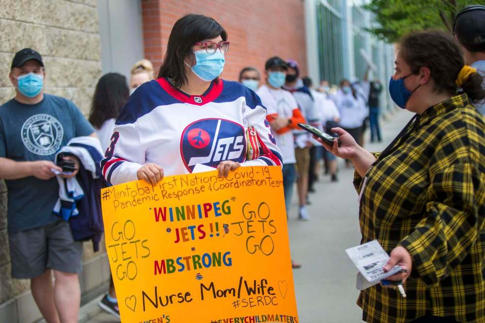 MIKAELA MACKENZIE / WINNIPEG FREE PRESS
Teresa Jensen, who works with Manitoba’s pandemic response team in First Nations communities, says she was ‘ecstatic and honoured’ to take in the Jets playoff game on Wednesday.