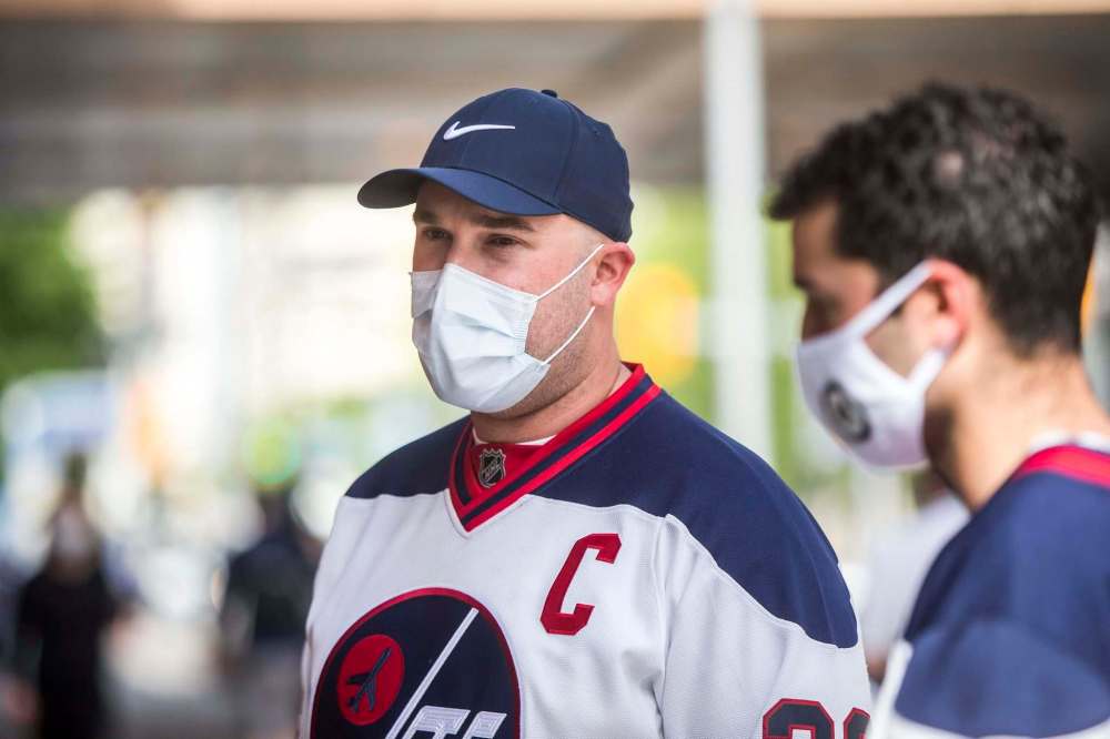 MIKAELA MACKENZIE / WINNIPEG FREE PRESS
Anesthesiologist resident physician Jesse Garber said pre-game excitement was still dampened by the reality of the province’s current COVID-19 situation.
