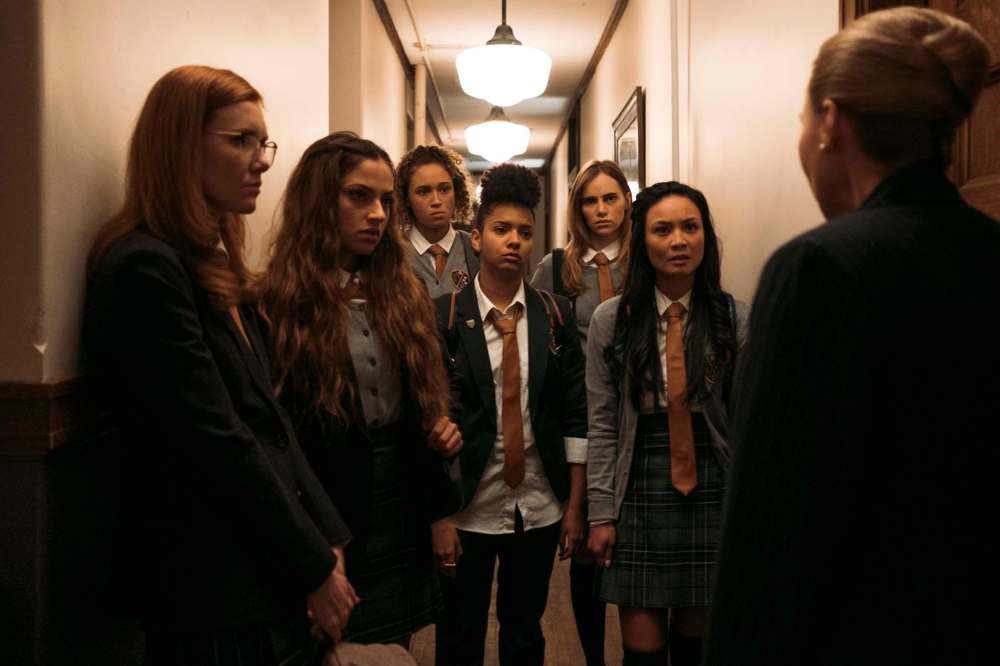 Madisen Beaty (from left) as Bethany, Inanna Sarkis as Alice, Ella-Rae Smith as Helina, Djouliet Amara as Rosalind, Suki Waterhouse as Camille, and Stephanie Sy as Yvonne in the horror movie Seance. (RLJE Films and Shudder photo)