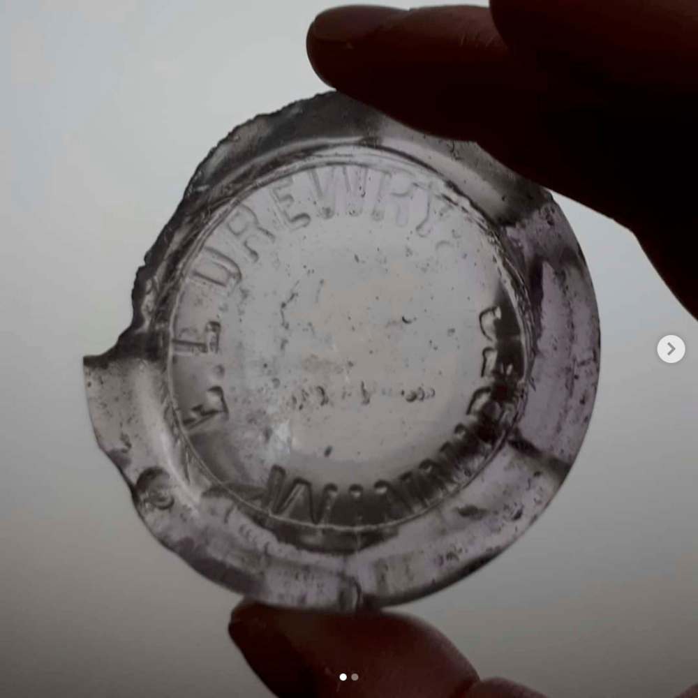 Instagram / Sally Ito
Mudlarking Research: Glass bottom of a local bottle from the Drewry Brewery.