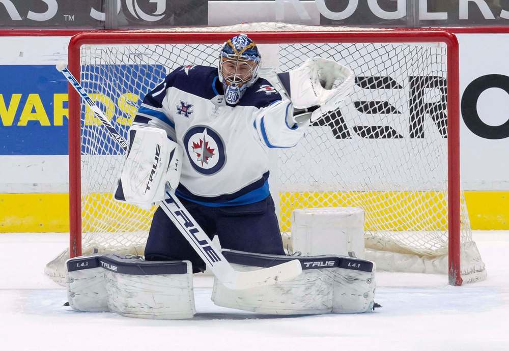 The Jets have goaltender Connor Hellebuyck under contract for the next three seasons. (Darryl Dyck / The Canadian Press files)