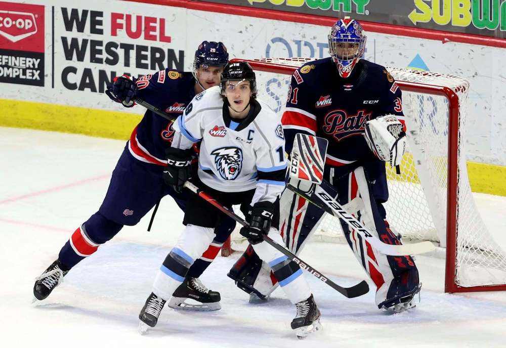 Keith Hershmiller photo
Winnipeg Ice captain Peyton Krebs (centre) was named the Western Hockey League's player of the year on Thursday.