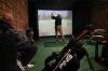 RUTH BONNEVILLE / WINNIPEG FREE PRESS
Lori Thompson and his friend, Lorne Jamison tee off at one of Rossmere Golf & Country Club’s Sim Shack golf simulator booths.