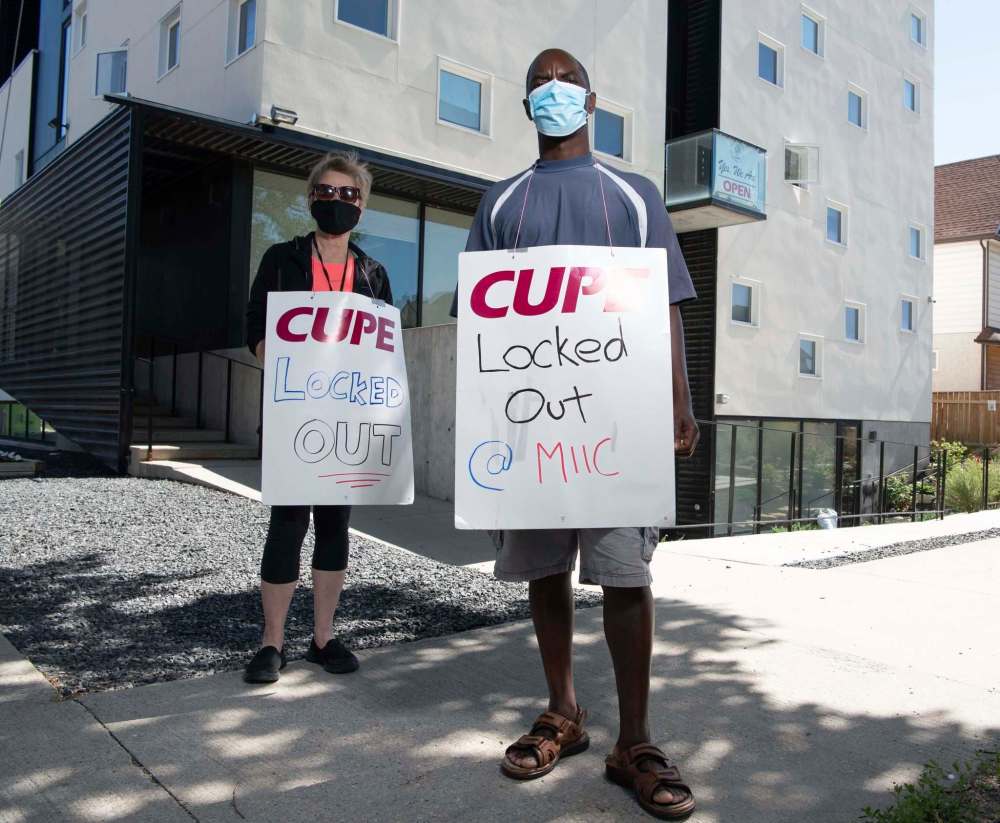 Lockedout refugee centre workers back on picket line Winnipeg Free Press