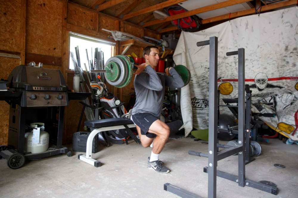 MIKE DEAL / WINNIPEG FREE PRESS
NHL draft prospect Carson Lambos works out in his home gym, the so-called ‘Gritty Garage’ Monday morning.