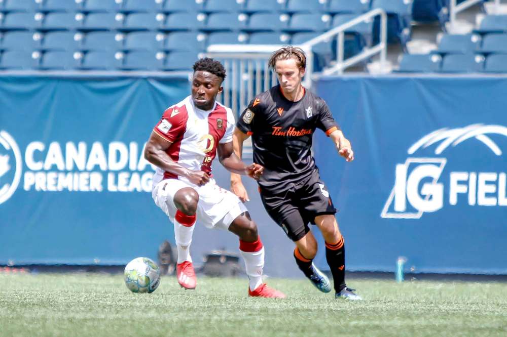 Robert Reyes/William Ludwick / CPL
Valour FC midfielder Raphael Ohin (left) battles a Hamilton player for possession.