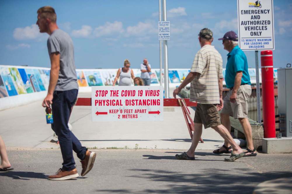 People are reminded that physical distancing guidelines are still in effect on the pier.