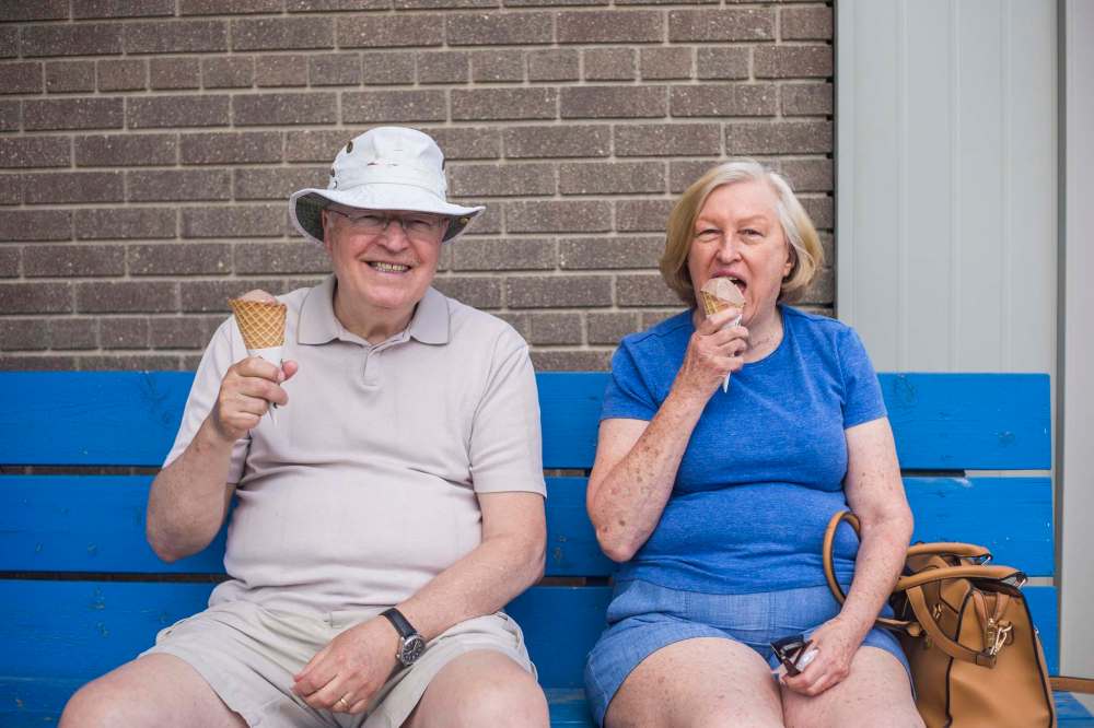 Gerry and Joy Derek enjoy chocolate ice cream cones on a beautiful summer day in Gimli.