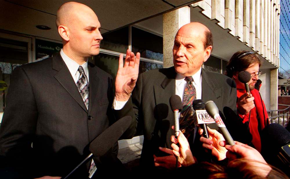 PHIL HOSSACK / WINNIPEG FREE PRESS Lawyers Keith Laboissiere (left) and Hymie Weinstein hold court outside the 911 hearings Tuesday, see Kim's story. Jan 8-02