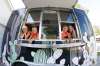 Erin Popoff, with her children Kodiak, 5, Makeiff, 7, and Olive, 9, in Popoff’s new food truck trailer, Poacht. (John Woods / Winnipeg Free Press)