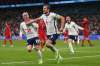 Laurence Griffiths / Pool Photo
England's Harry Kane, right, celebrates with his teammates after scoring his side's second goal during the Euro 2020 soccer semifinal match between England and Denmark at Wembley stadium in London, Wednesday.