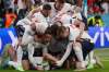England's Harry Kane, bottom, celebrates with his teammates after scoring his side's second goal during the Euro 2020 soccer semifinal match between England and Denmark at Wembley stadium in London, Wednesday, July 7, 2021. (Laurence Griffiths/Pool Photo via AP)