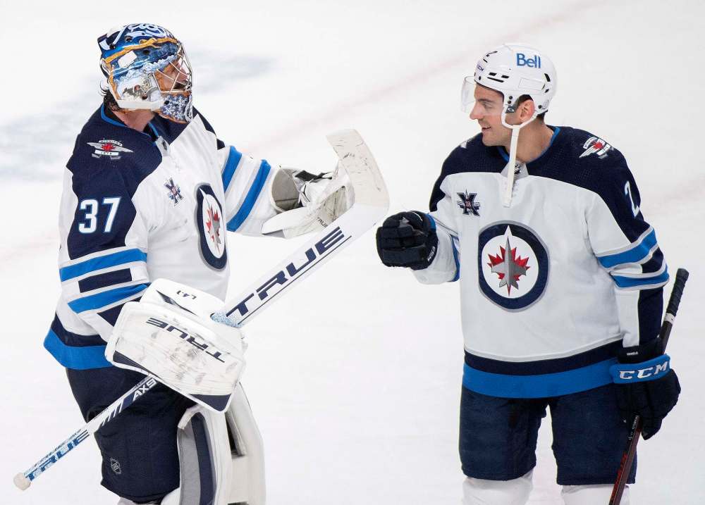 Winnipeg Jets goaltender Connor Hellebuyck was a no-brainer to protect while armchair general managers across social media have condemned the team's decision to leave Dylan DeMelo unprotected for the Kraken expansion draft this Wednesday. (Graham Hughes / The Canadian Press files)