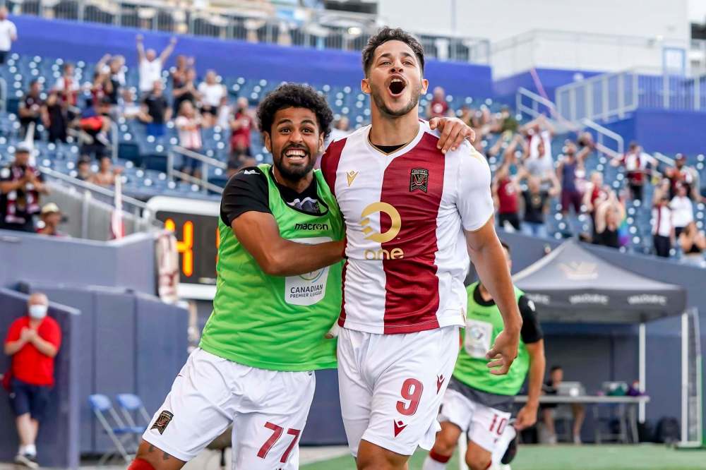 Austin Ricci of Valour FC celebrates his first-half goal against York United FC with teammate Federico Peña.