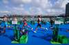 Tyler Mislawchuk (centre) runs through the second transition during the men’s individual triathlon at the Summer Olympics in Tokyo. (David Goldman / The Associated Press)