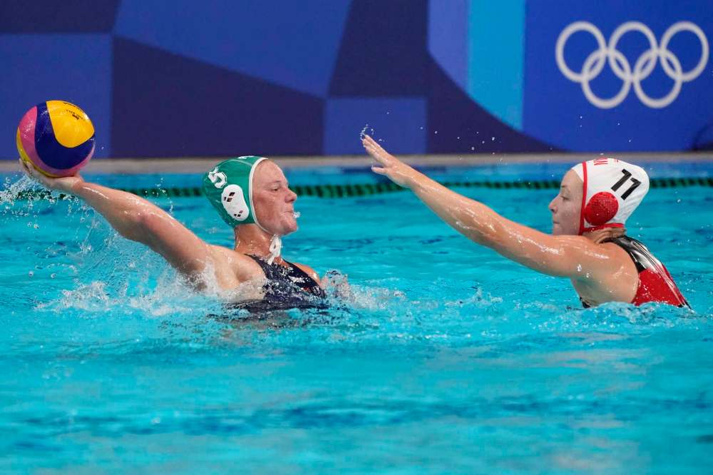 Mark Humphrey / The Associated Press
Canada's Kindred Paul (11) defends against South Africa's Megan Sileno (5) during a preliminary round women's water polo match at the 2020 Summer Olympics, Wednesday, July 28, 2021, in Tokyo, Japan.