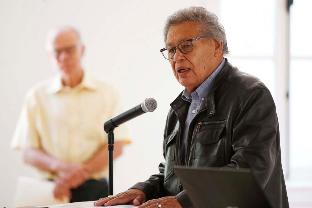 Jim Bear, former chief of Brokenhead First Nation, spoke at an Emancipation Day event as organizer, Jon Gerrard, MLA, listens in at St Norbert Arts Centre Sunday. (John Woods / Winnipeg Free Press)