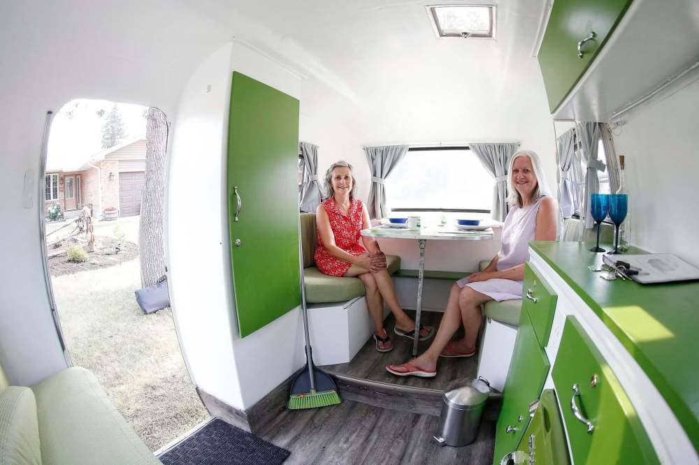 JOHN WOODS / WINNIPEG FREE PRESS
Friends Susan Hopps (left) and Sharon McCoomas bought and renovated a 1973 Boler last year. When it was first listed as a rental, they had 60 replies in the first hour.