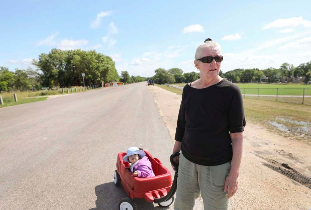 RUTH BONNEVILLE / WINNIPEG FREE PRESS  
Val Klassen, towing her granddaughter along the trail, said members of her family have noted the trails have become more unsafe in recent years.