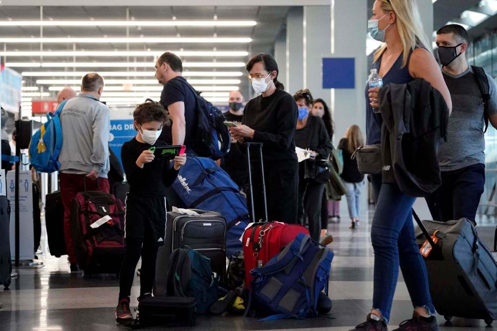 Nam Y. Huh / The Associated Press
Passengers navigate the crowds at O'Hare airport in Chicago on July 2. As movement resumes after a 16-month pandemic pause, it's time to consider the ethics of travel.