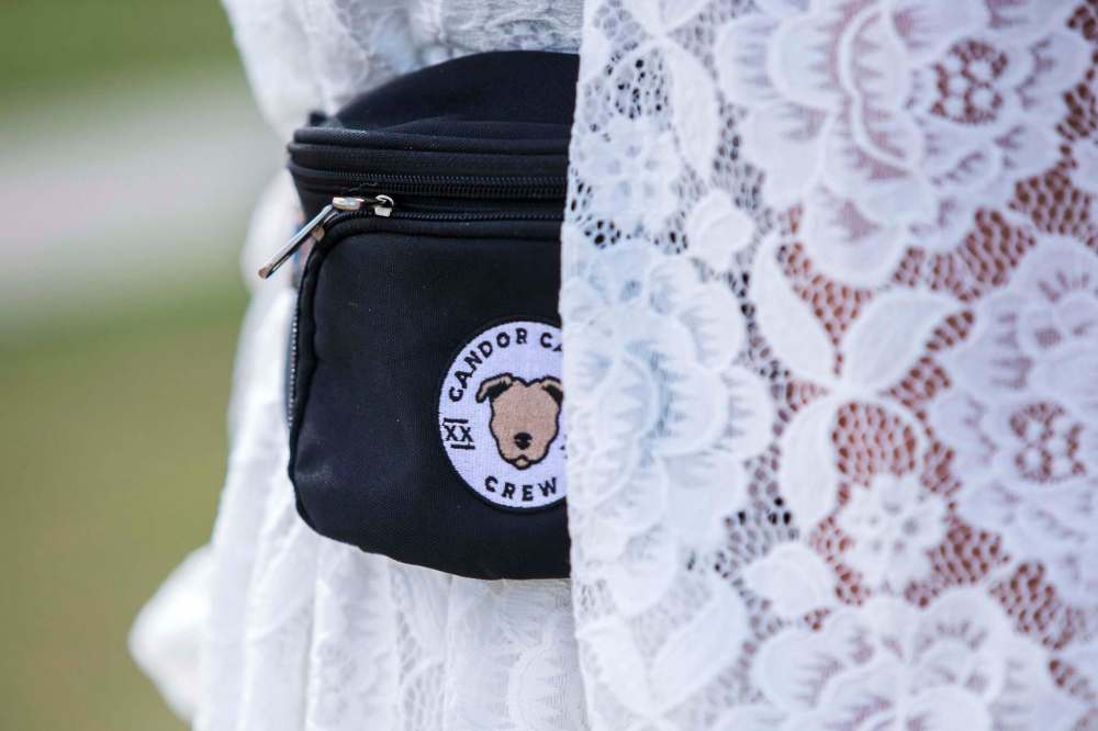 MIKAELA MACKENZIE / WINNIPEG FREE PRESS
Jamie Barber, owner and head trainer of Candor Canine, carries a branded fanny pack with treats and supplies to keep dogs calm at weddings.