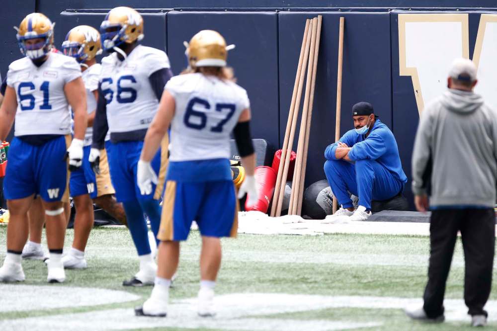JOHN WOODS / WINNIPEG FREE PRESS
Winnipeg Blue Bombers’ running back Andrew Harris sits and watches his team practice last week. There is no new update on Harris's condition or indication of when he will return to game action.