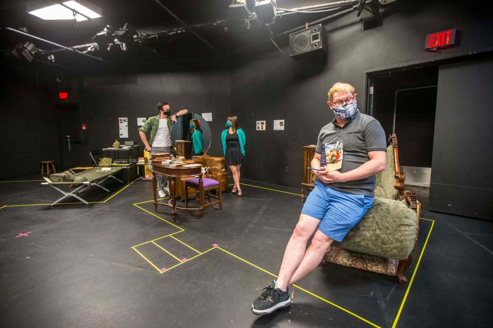 Director Ari Weinberg (right) and actors Justin Stadnyk (left) and Becky Frohlinger take a break from rehearsing upcoming Winnipeg Jewish Theatre production Dear Jack, Dear Louise at Prairie Theatre Exchange. (Mikaela MacKenzie / Winnipeg Free Press)