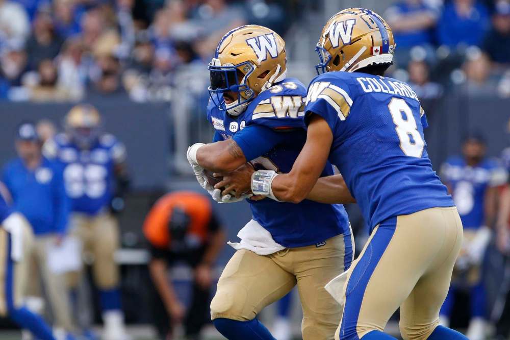 Bombers QB Zach Collaros hands off to Andrew Harris against the Calgary Stampeders last Sunday. Harris returned to the lineup last week as he continues to recover from a calf injury. (John Woods / The Canadian Press files)