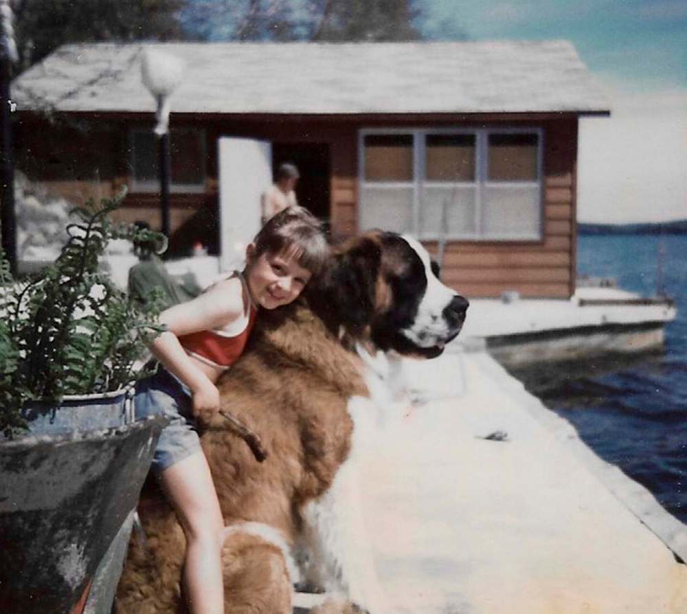 SUPPLIED
Gerry-Jenn Wilson with her beloved childhood dog, a gentle giant of a St. Bernard named Junior.