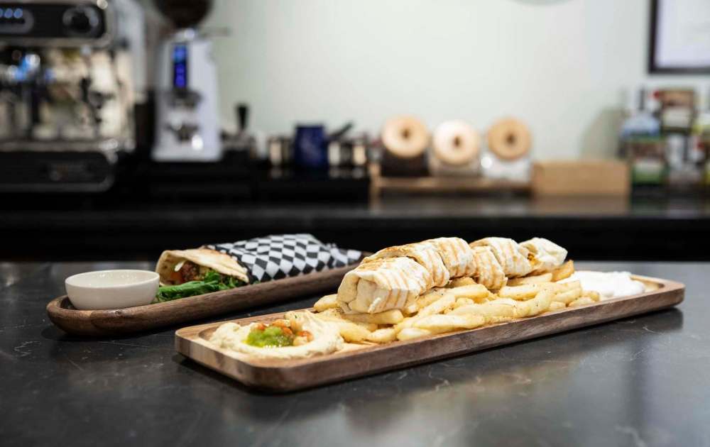 JESSICA LEE / WINNIPEG FREE PRESS
Zaytoon serves traditional Middle Eastern food with a twist, along with more familiar fare such as falafel wraps (left) and shawarma plates.