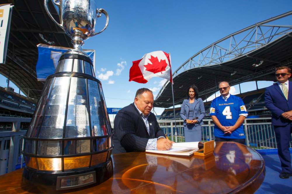 MIKE DEAL / WINNIPEG FREE PRESS
Premier Kelvin Goertzen, Wade Miller, president and CEO, Winnipeg Football Club and Dayna Spiring, chair, board of directors, Winnipeg Football Club, along with other dignitaries were on hand at IG Field Tuesday afternoon, for the signing-in of the 2019 Grey Cup Champions into the Order of the Buffalo Hunt.