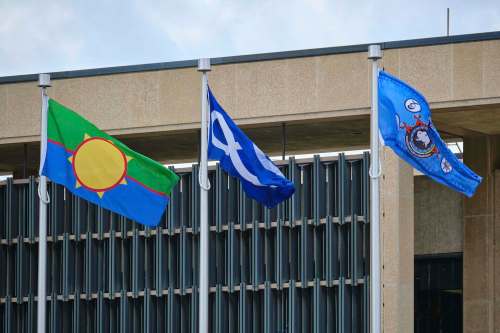 MIKE DEAL / WINNIPEG FREE PRESS Flags representing (from left) Treaty One First Nations, the Métis Nation and Dakota Nations were raised at City Hall Wednesday morning and will be flying permanently as part of an ongoing commitment to reconciliation.