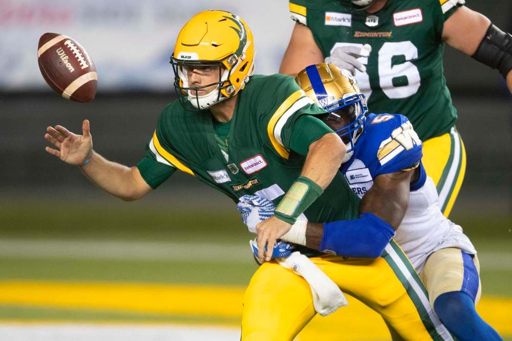 Blue Bombers' Willie Jefferson knocks the ball loose from Elks quarterback Taylor Cornelius on Saturday. The Elks see Cornelius eventually taking over from starting Elks QB Trevor Harris. (Jason Franson / The Canadian Press files)