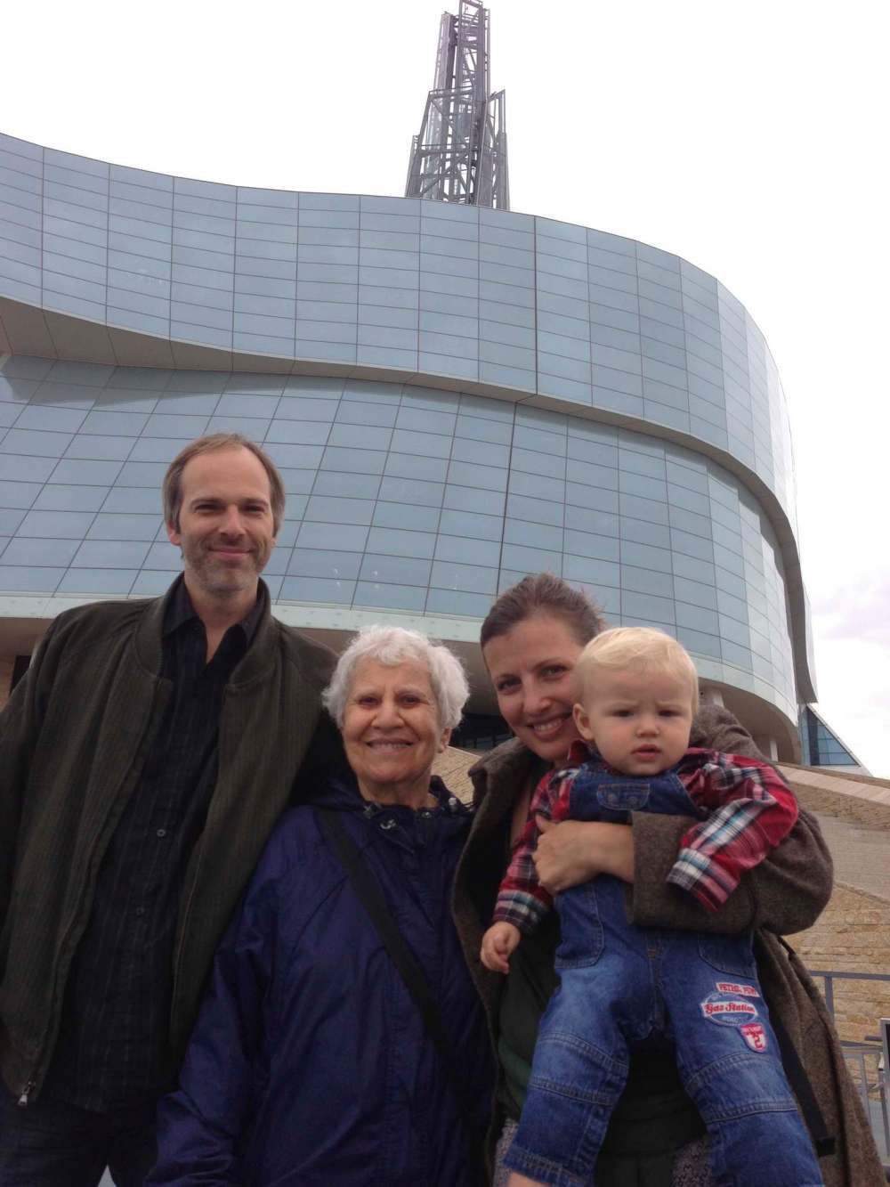 Carol Sanders / Winnipeg Free Press
Marmel (centre) with her neighbour, Sheldon Toews, his wife, Maureen Polischuk, and their son, Luke, in front of the Canadian Museum for Human Rights in 2014.