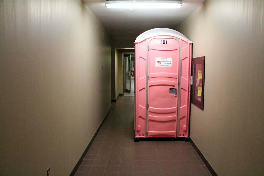 GABRIELLE PICHE / WINNIPEG FREE PRESS
Six port-a-potties were on the ground floor of 400 Webb Place for residents to use.