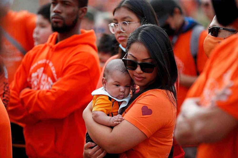 Several thousand gathered downtown on the National Day for Truth and Reconciliation Thursday. (John Woods / The Canadian Press)