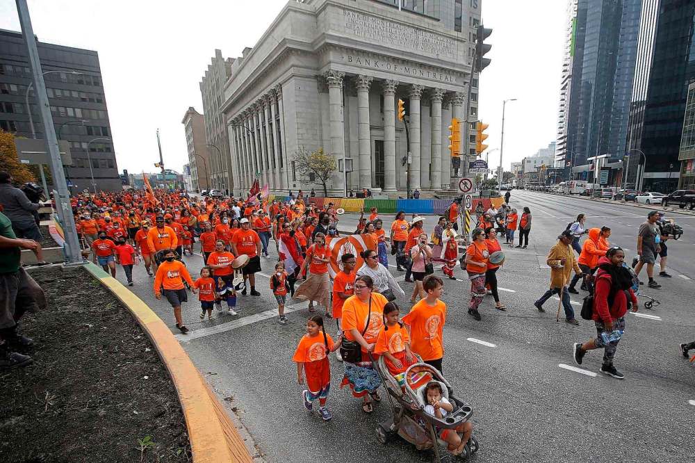 Thousand walked through downtown Winnipeg Thursday on the National Day for Truth and Reconciliation. (John Woods / The Canadian Press)