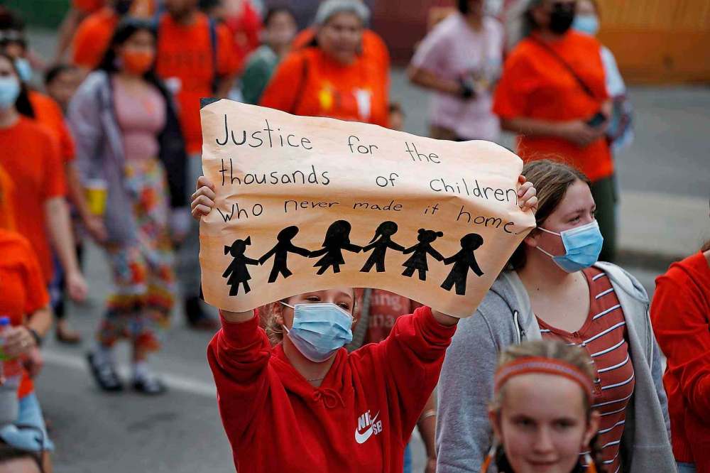 Thousands of people walked through downtown Winnipeg Thursday on the National Day for Truth and Reconciliation. (John Woods / The Canadian Press)