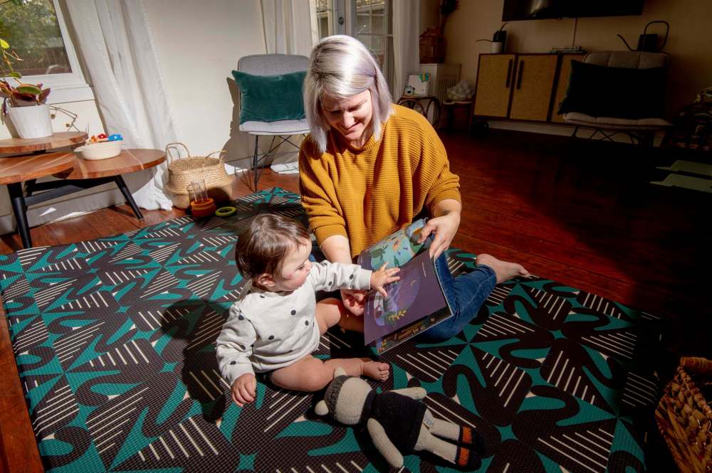 MIKE SUDOMA / Winnipeg Free Press
Coates reads her book to her daughter Lark.
