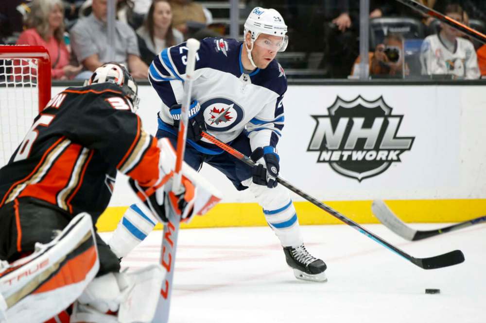 Winnipeg Jets centre Paul Stastny shoots against Anaheim Ducks goaltender John Gibson, left, during the first period in Anaheim, Calif., Wednesday. (AP Photo/Alex Gallardo)