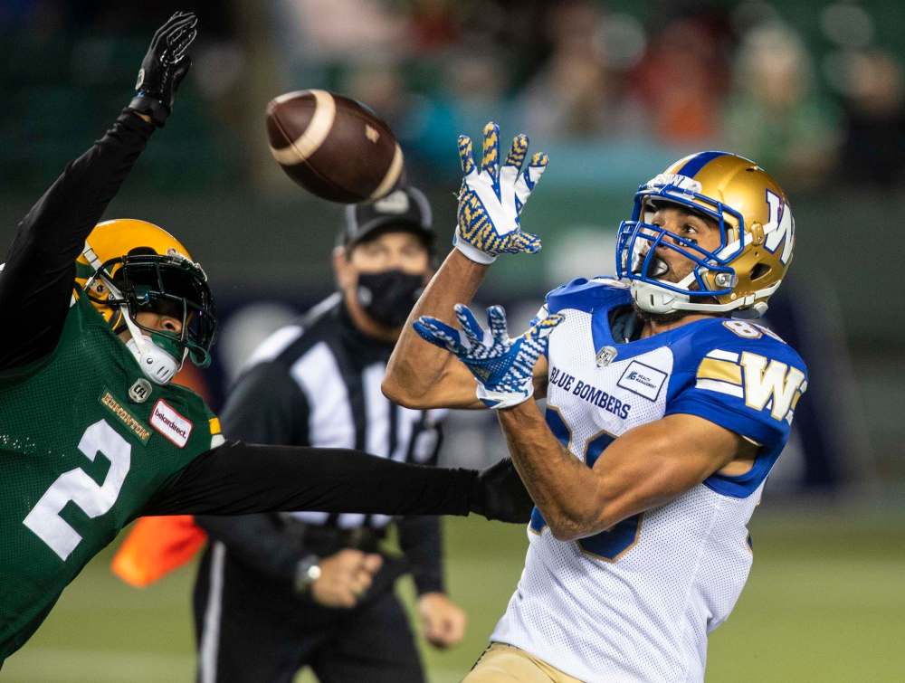 Kenny Lawler hauls in a 47-yard pass late in the first half that brought the ball to the Elks' 11. (Jason Franson / The Canadian Press)